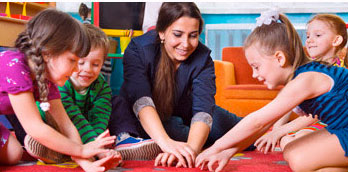 Two children painting together